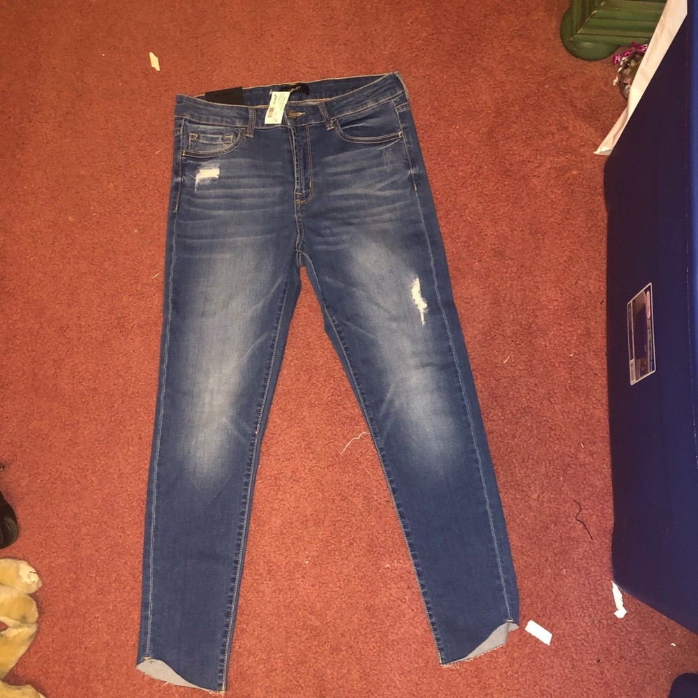 Blue distressed jeans. New with tags